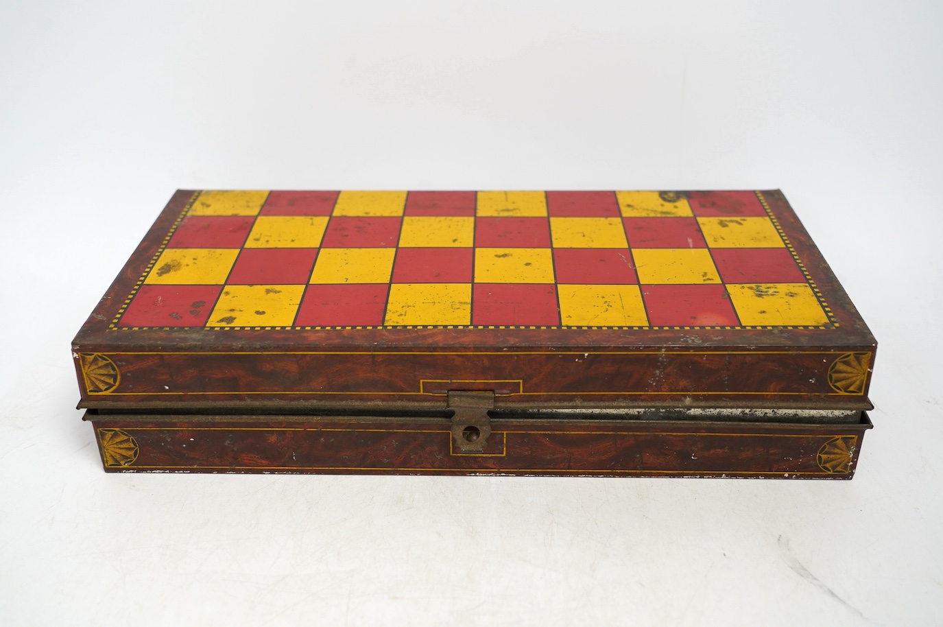 An early 20th century Carrs novelty 'dice game' biscuit tin, a Don Confectionery 'chessboard' tin and a Wright & Son Ltd inkstand tin, largest 33cm wide. Condition - fair